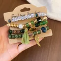 Bohemian vintage multi-layer beaded bracelet set with wood beads and green tassel charm. - Heart / Four-Piece Set / Gold-Green