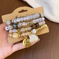Retro ethnic style 6-piece beaded bracelet set with wooden and coconut shell beads - Tassel / Four-Piece Set / Gold-White