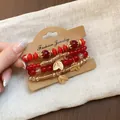 Retro ethnic style multi-layer red beaded bracelet set featuring delicate gold leaf charms - Leaf / Four-Piece Set / Gold-Red