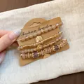 Retro ethnic style beaded bracelet set with gold leaf charms displayed on card - Leaf / Four-Piece Set / Gold-Light Coffee