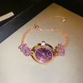 Detailed close-up of rose gold bracelet watch with purple sunray dial and floral crystals. - Purple Radial Pattern Dial / Sliding Adjuster Buckle / Bracelet-Gold-Purple