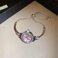 Close-up of pink dial rhinestone bracelet watch with adjustable pull-out chain - Round Dial / Silver-Pink