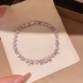 Elegant silver-toned bracelet featuring alternating pink and clear heart-shaped zircons. - Heart Square Staggered Style (16#)