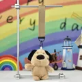 Detail view of a cute fluffy dog plush keychain featuring a khaki fabric wrist strap - Big Nose Dog - Long Ear Light Brown (Colored Strap)