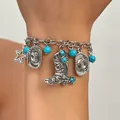 Close-up of Western-style charm bracelet featuring cowboy boots and turquoise beads - Artificial Turquoise Western Pendant Bracelet (7337)