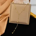 Elegante collar lariat de acero inoxidable dorado con detalles de cuentas pulidas - Estilo de Borla de Bola Grande y Pequeña (H1510) / Dorado
