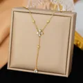 Elegant gold stainless steel necklace with sparkling clover flower and teardrop pendant - Clover White Rhinestone Tassel Style (H1521) / Gold