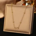 Collar de infinito en acero inoxidable dorado con colgante de cristal brillante - Estilo Infinito de Strass Completo (H1523) / Dorado