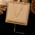Elegante collar en Y de acero inoxidable dorado con detalles de barras y cuentas - Estilo de Tira Larga de Cuentas Redondas (H1525) / Dorado