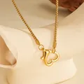 Detailed view of a gold heart-shaped carabiner clasp on a stainless steel box chain. - Gold Heart Necklace (B703) / Gold