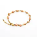 Elegante pulsera de acero inoxidable chapado en oro con amuletos de mal de ojo rosa - Pulsera - Cuenta Redonda Rosa