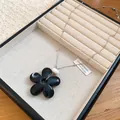 Close-up of minimalist black resin flower pendant on a silver beaded chain - Black Five-petal Flower Style (72#) / Silver/Black