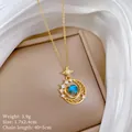 Detailed view of the star and moon pendant with a blue star stone and sparkling crystals - 镂空月亮款式(G147) / 1 Piece / Gold