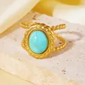 Close-up of boho 18K gold plated titanium steel ring with a large turquoise stone inlay. - Turquoise Tone Oval Vintage Ring (A710 Gold Blue Oval Ring) / One Size (A710) / Gold