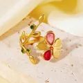 Close-up macro detail of 18K gold-plated stainless steel ring with colorful floral design - Pink Flower Green Leaf Ring (A710 Gold Pink Flower Green Leaf Ring) / One Size (A710) / Gold