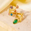 Detail of 18K gold plated titanium steel ring with vibrant colorful stones and leaf motifs. - Multi-Color Rhinestone Branch Leaf Ring (A710 Gold Colorful Leaf Ring) / One Size (A710) / Gold