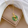 Detailed view of an elegant emerald green pendant necklace on a jewelry display box - Gold Flower Green Circle (G107)