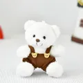 Detailed view of a soft white plush teddy bear wearing cute brown corduroy overalls toy - White Bear With Brown Overalls / 12cm (Bead Chain)