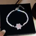 Elegant silver-tone snowflake tennis bracelet with pink zircon on black velvet - Pink