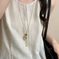 Collana con ciondolo a cuore dorato geometrico retrò con perla occhio di tigre su lino - Cuore Dorato (49#)