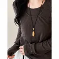 Elegante collana vintage con ciondolo a goccia dorata su lungo cordino nero per donna - Oro Nero Opaco (52#)