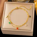 Elegante pulsera de trébol chapada en oro de 18 quilates con dijes coloridos - Trébol de concha de color (E2538) / Dorado