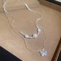 Elegante doppellagige Silberkette mit weißen Perlen und funkelndem Sternanhänger - 46# Halskette Pentagramm Perle Doppelt