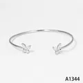 Elegante roestvrijstalen open armband met vlinders en zirkonia-stenen - Armband (A1344) / Zilver
