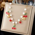 Sweet cherry and imitation pearl necklace featuring gold heart charms on display box. - Artificial Pearl Chain Cherry Heart Multi Charm (N4578)