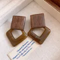 Macro detail of vintage geometric earrings crafted with wood and brown acrylic squares - Geometric Splicing (HE35261) / Silver Earring Post - Coffee
