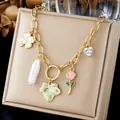 Detail of a gold stainless steel necklace featuring enamel rose, clover, and heart charms. - Multi Element Enamel Artificial Pearl Heart Zirconia Chain (N4575)
