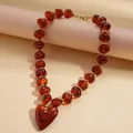 Vintage amber acrylic beaded necklace with a large heart pendant for women - Necklace / Brown