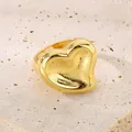 Bold chunky 18K gold plated stainless steel heart-shaped statement ring displayed on stone - 18mm Gold Full Heart Style