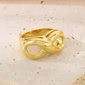 18K gold-plated stainless steel infinity symbol ring on stone texture background - 13mm Gold Infinity Style