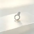Detailed macro view of a rotatable stainless steel handcuff-shaped spring clasp. - Steel