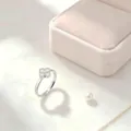 Close-up of an elegant silver four-leaf clover ring with crystals on a light background - Size 5 / 2.0mm / Silver