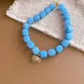 Vintage-Halskette mit hellblauen Harzperlen und goldenem Herzanhänger im Retro-Stil - Blauer Perlenstil / Halskette-Blau