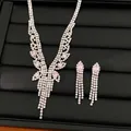 Luxurious jewelry set featuring pink stones and sparkling zircon tassels on a black tray - Necklace Earrings 2-Piece Set / Silver-Pink