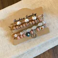 Bohemian multi-layer bracelet set with anchor charm and patterned beads on display card - Style 7
