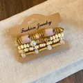 Detailed close-up of bohemian style acrylic bead bracelet set with gold accents. - Style 3 / 4 Pieces/Pack / Gold-Khaki
