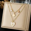 Close-up of double-layered gold-plated necklace featuring heart and clover charm pendants - White Enamel GOODLUCK Heart Clover Layered Chain (N4564)