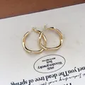 Elegant geometric gold hoop earrings with irregular organic circular design for daily wear. - 3cm (88#) / Light gold