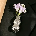 Elegant silver peanut-shaped vase brooch with purple flowers on black suit lapel - Silver (08 White K 8542)