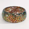 Close-up of vintage wide resin bangle with colorful embedded geometric sequins - Triangular Sequin Round (M-785) / Green