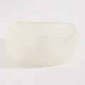 Macro detail of a minimalist chunky off-white resin bangle with a smooth glossy finish - Irregular Height (K-049) / Clear