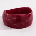 Detailed view of dark red marbled resin chunky bangle with unique white swirl patterns - Irregular Height (4608) / Rose Red