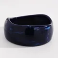 Close-up detail of a vintage navy blue marbled resin wide bangle with a glossy finish - Irregular Height (DZ-779) / Dark Blue