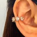 Elegant golden ear cuff with three sparkling cubic zirconia stones for non-pierced ears - Triple Stone Ear Cuff (1 Piece) / Gold