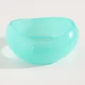 Macro detail of a vintage turquoise resin wide bangle with translucent jelly texture - Twisted (2184) / Green