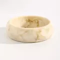 Close-up detail of a vintage marbled resin wide bangle with cream and brown patterns - Small Round (A-735) / 22mm / White